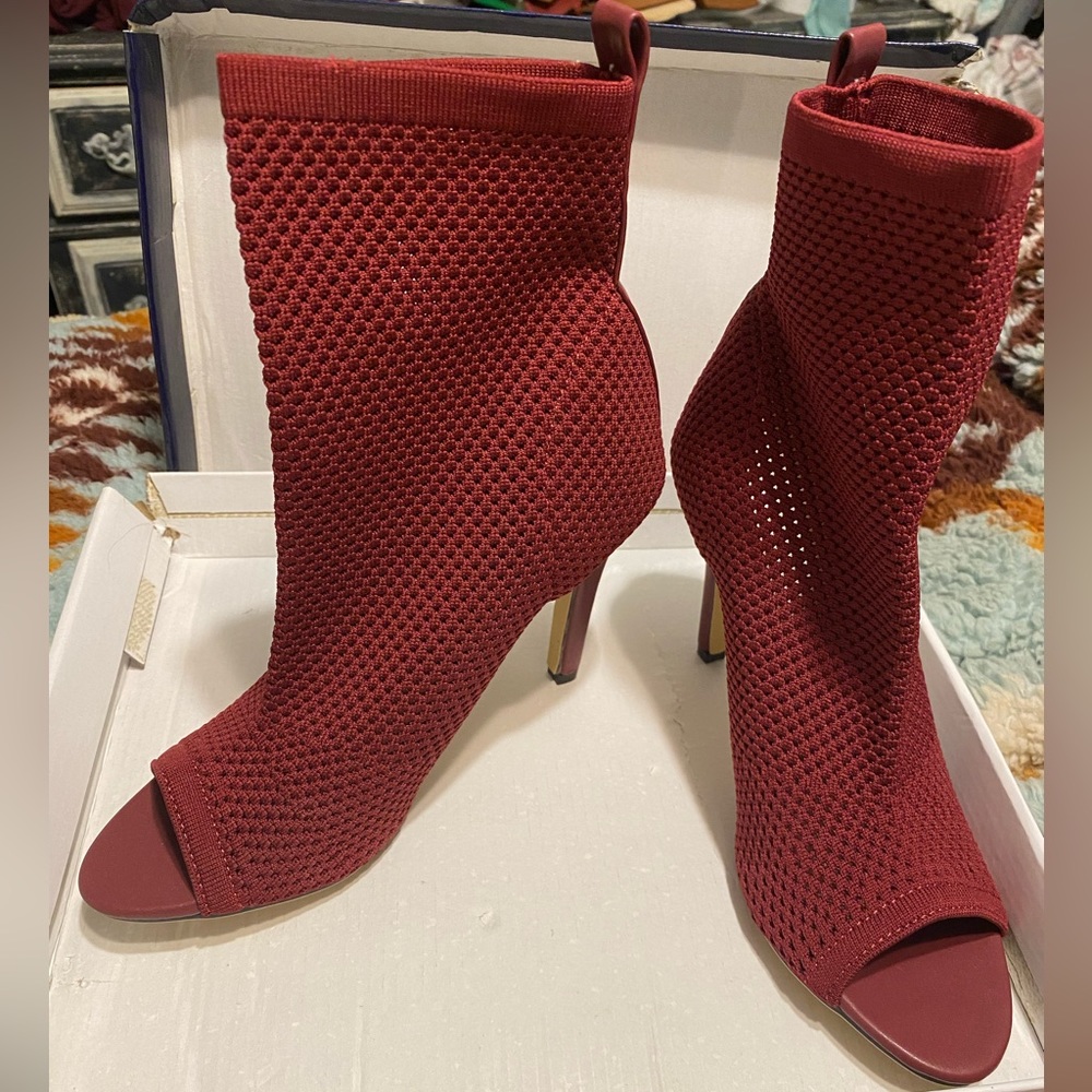 Dark red, peep-toe sock “bootie” heels.